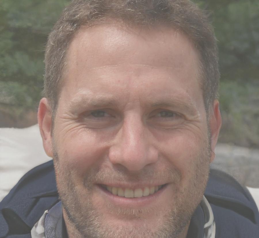 Professional headshot of testimonial author